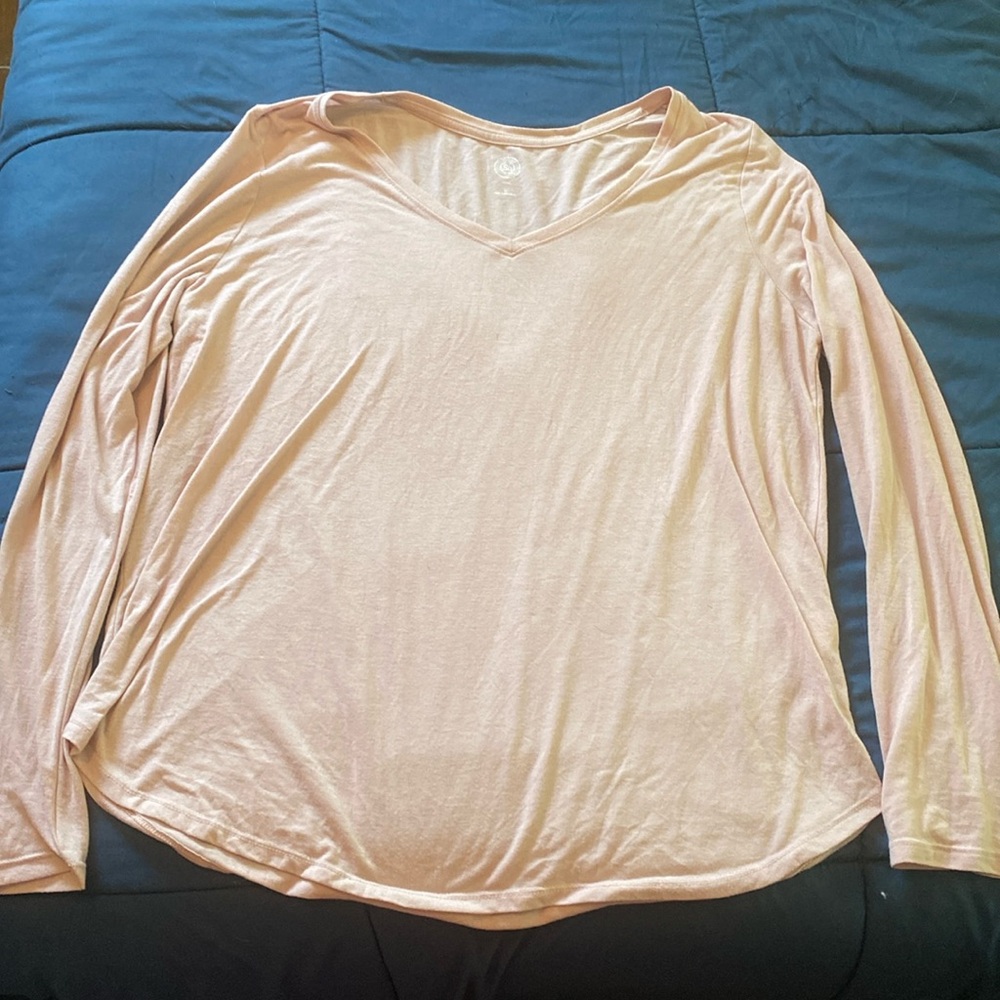 Light pink v-neck long sleeved shirt.